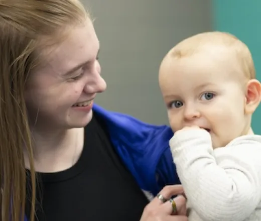 smiling woman and baby