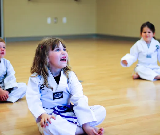 Children practicing Taekwondo in a karate class in Kentucky, demonstrating various techniques and forms.